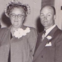 Titus & Yvonne Hawkins Old photo of a middle-aged couple wearing their Sunday best